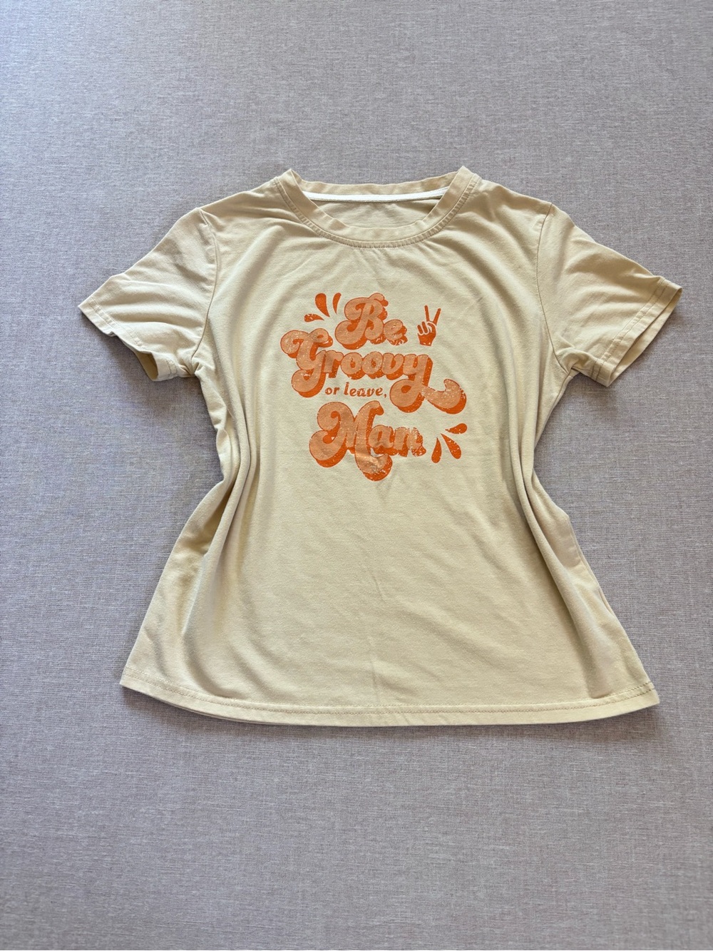 Groovy retro style tan & orange graphic t-shirt.